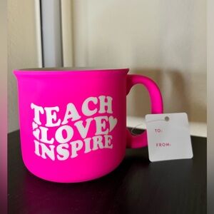 Hot pink 16 oz mug with the Phrase “ Teach, love, inspire” on both sides